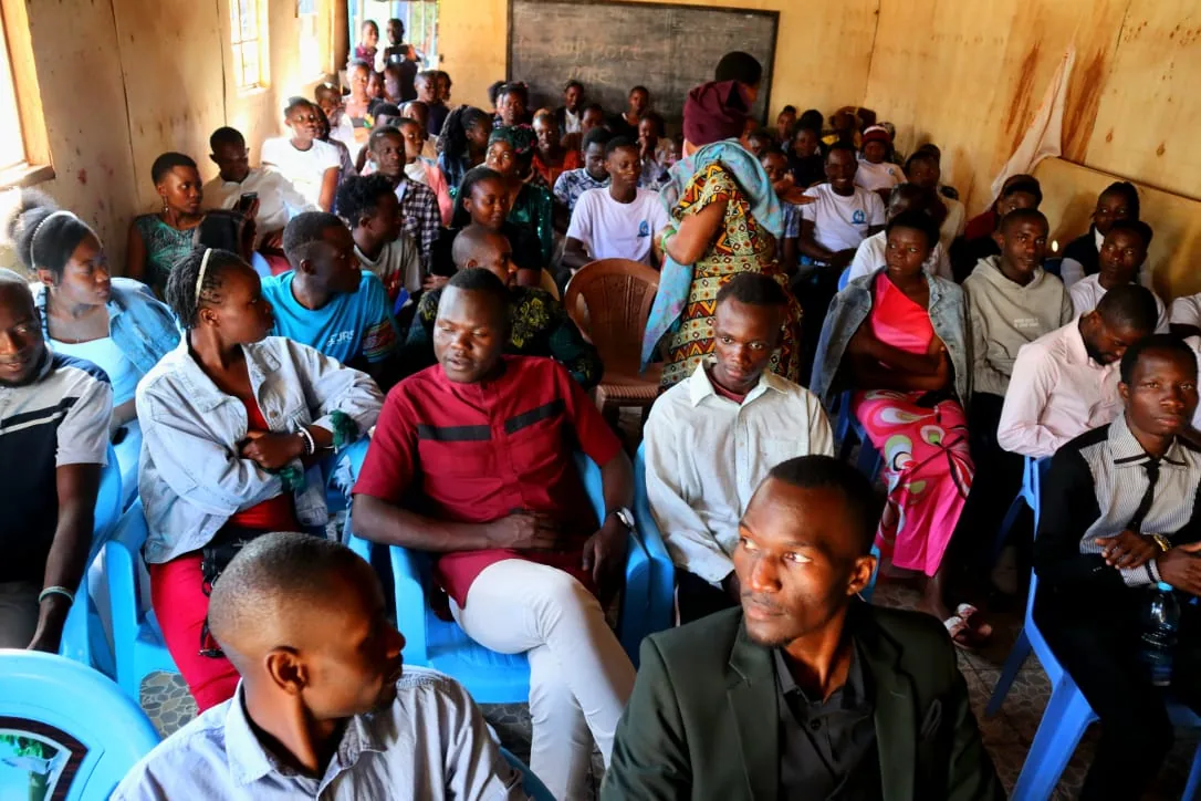 Residents seated together at a community meeting