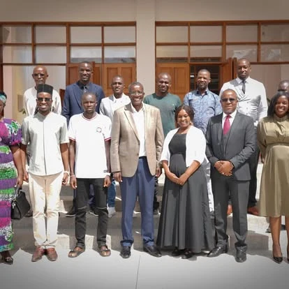 Maxwell Changilwa with a group of residents